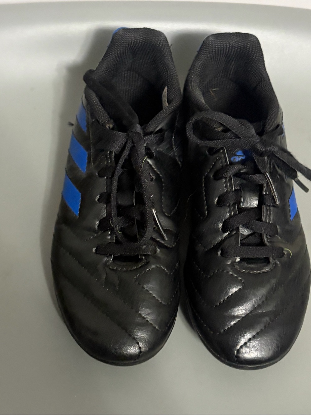 Boys black and blue Adidas cleats